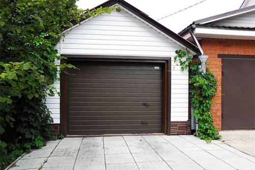 Какие ворота для гаража лучше рулонные или секционные? - фото 4